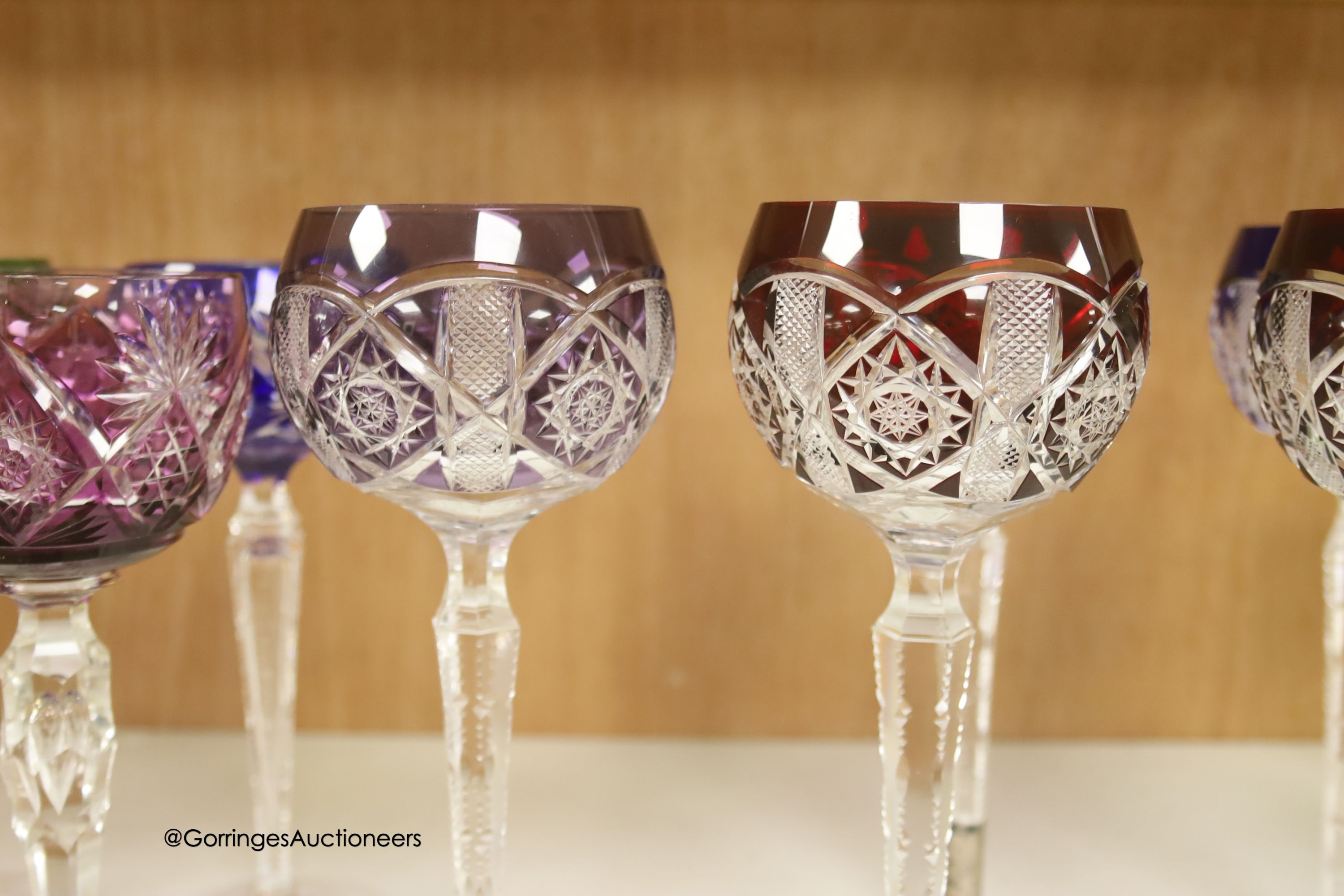 A harlequin collection of flash cut hock glasses, 19th century and later, tallest 21cm